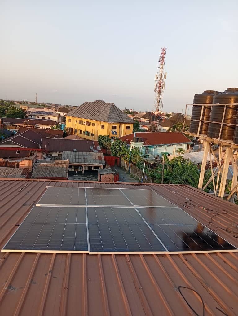 Four monocrystalline solar panels installed on a rooftop in Port Harcourt